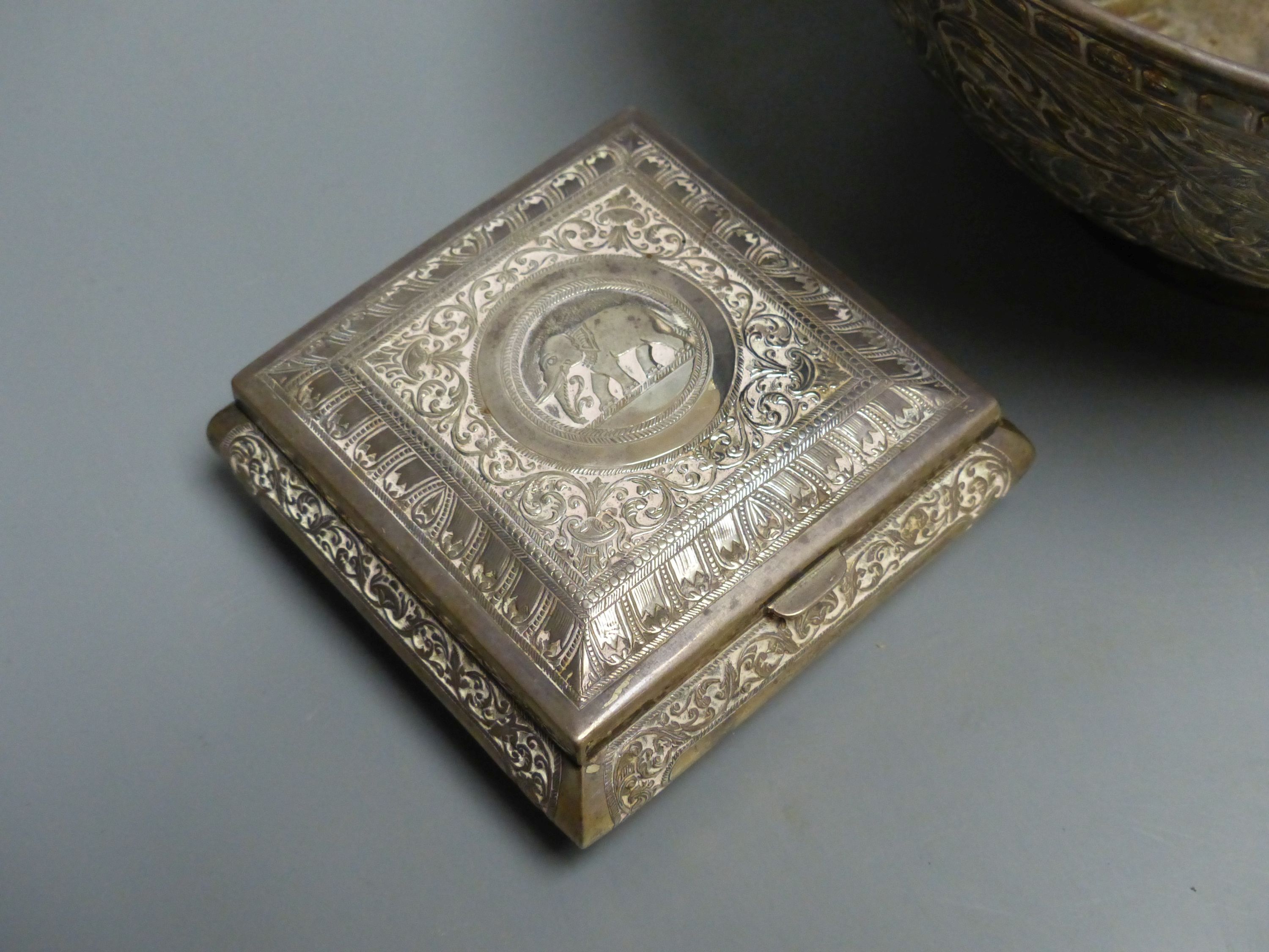 An Indian? white metal bowl, on pedestal foot, height 12.8cm, 23oz and a similar small white metal mounted cigarette box.